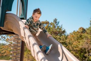 boy sliding down slide